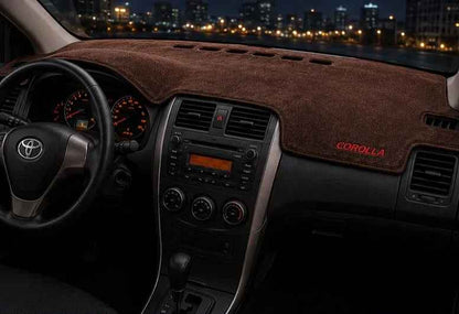Toyota Corolla dashboard mat in brown suede enhancing 2009-2014 interior with premium protection.